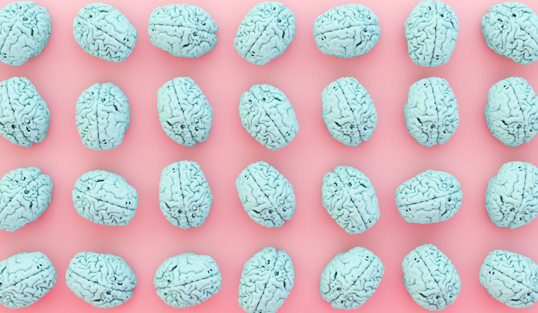 A pink and blue graphic patterned image of brains.