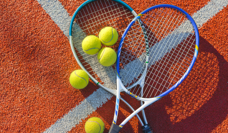 Tennis racket and balls.