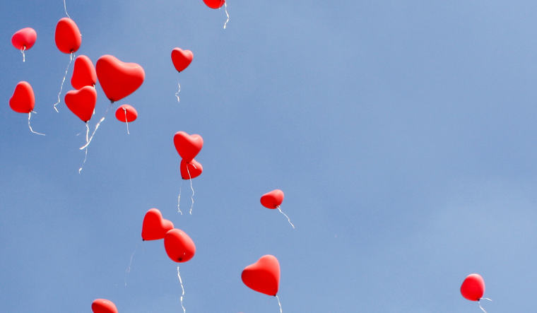 Heart balloons in the air.