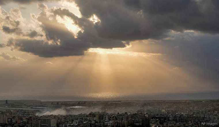 Smoke rises after an Israeli airstrike that hit Dahiyeh suburb, as the sun sets over Beirut, Lebanon, Tuesday, Oct. 1, 2024.