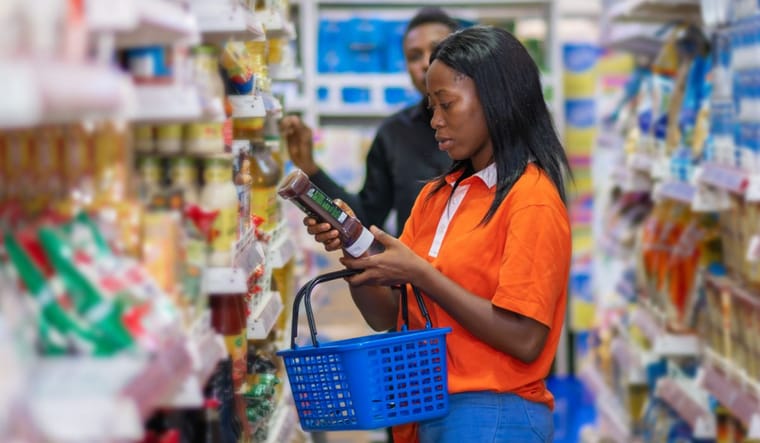 Person shopping in grocery store.